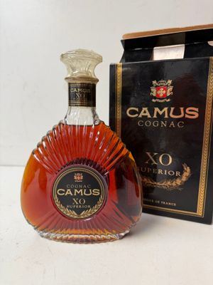 an image of a bottle of camus cognac next to a box