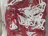 a bag of red and white paper clips in it