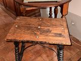 two tables with books on top of them in a room