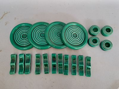several pieces of green plastic sitting on top of a table