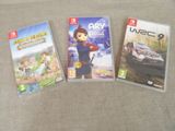 trois jeux Nintendo Wii posés les uns à côté des autres sur un canapé