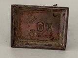 an old silver plate with the word go on it