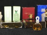 a lot of perfumes that are sitting on a table