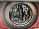 a close up of a car ' s dashboard with tools in it