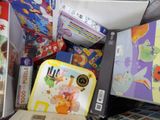 many children ' s books and games on the table