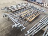 a lot of steel pipes and poles in a warehouse