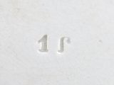 an antique silver plate with the number 11 on it