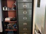 a tall cabinet with many drawers in it