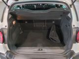 the back of a car with its trunk open and luggage in the trunk