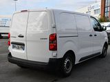a white van that is parked in a parking lot