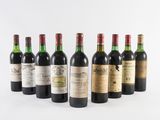 a group of six bottles of wine sitting next to each other