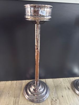 two candles that are sitting on a wooden table