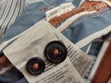 a close up of a pair of buttons on the back of a jacket