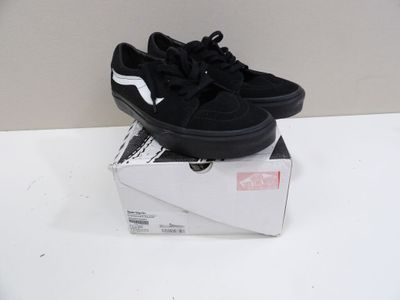 vans old skooler black and white sneakers on a box