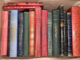 many old books in a box on the shelf