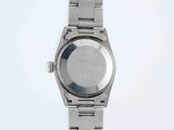 a close up of a watch on a white surface with a white background