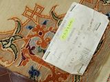a piece of paper that is on the floor next to a wallet