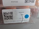 a person holding a plastic container with a qr code on it