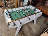 a foosball table in the middle of a room