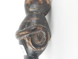 a black and brown cat head on a white wall