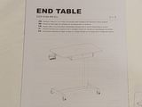 a picture of a white end table with instructions on it