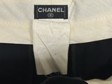 a close up of a chanel label on a black and white jacket
