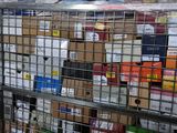 a metal cage filled with many different types of boxes