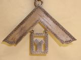 a picture of a house with a key hanging from it ' s roof