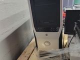 a computer sitting on top of a wooden table
