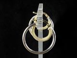 a silver and gold ring with a snake on top of it