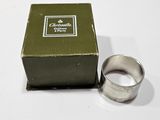 a box with a ring inside of it on a table
