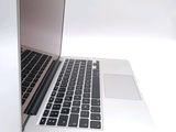 a close up of a laptop computer on a white surface