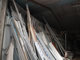 several pieces of metal are stacked up in a warehouse