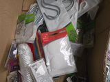 a cardboard box filled with various items that include scissors, scissors, and other items