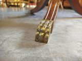 a brush that is sitting on the floor in front of a table