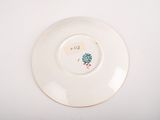 a plate with a picture of a bird on it