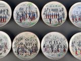six plates with a picture of a group of people on them
