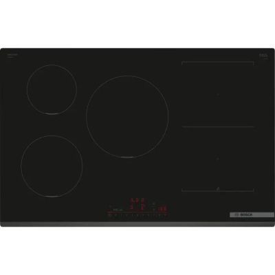 une plaque de cuisson noire à trois feux et trois boutons