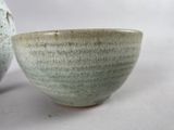 two bowls sitting next to each other on a table