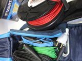 a lot of wires and cords in a bag