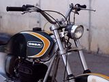 a motorcycle that is parked on the side of the street