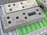 a pile of concrete blocks sitting on top of a metal rack
