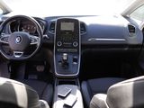the interior of a car with a steering wheel, dashboard, and dashboard controls