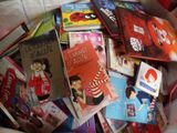 many children ' s books in a basket on the floor