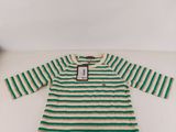 a green and white striped dress on a white table