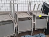 a lot of metal shelvings that are sitting on the floor