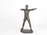 statue of a man with his arms outstretched in the air