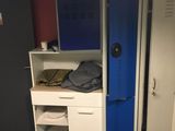 two lockers in a room with a computer on top of them