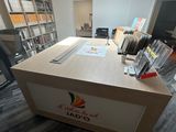 a desk that has a lot of books on it