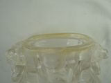 a clear glass vase with a flower design on it